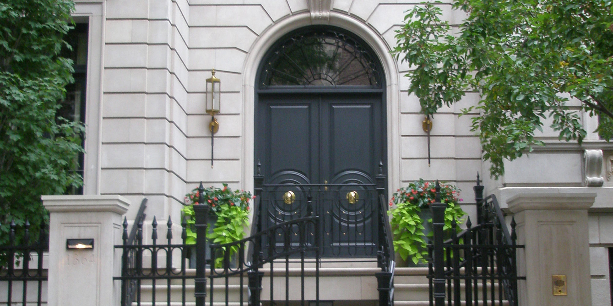 Custom Exterior Sconces by Chicago Luxury Designers Soucie Horner, Ltd in use.