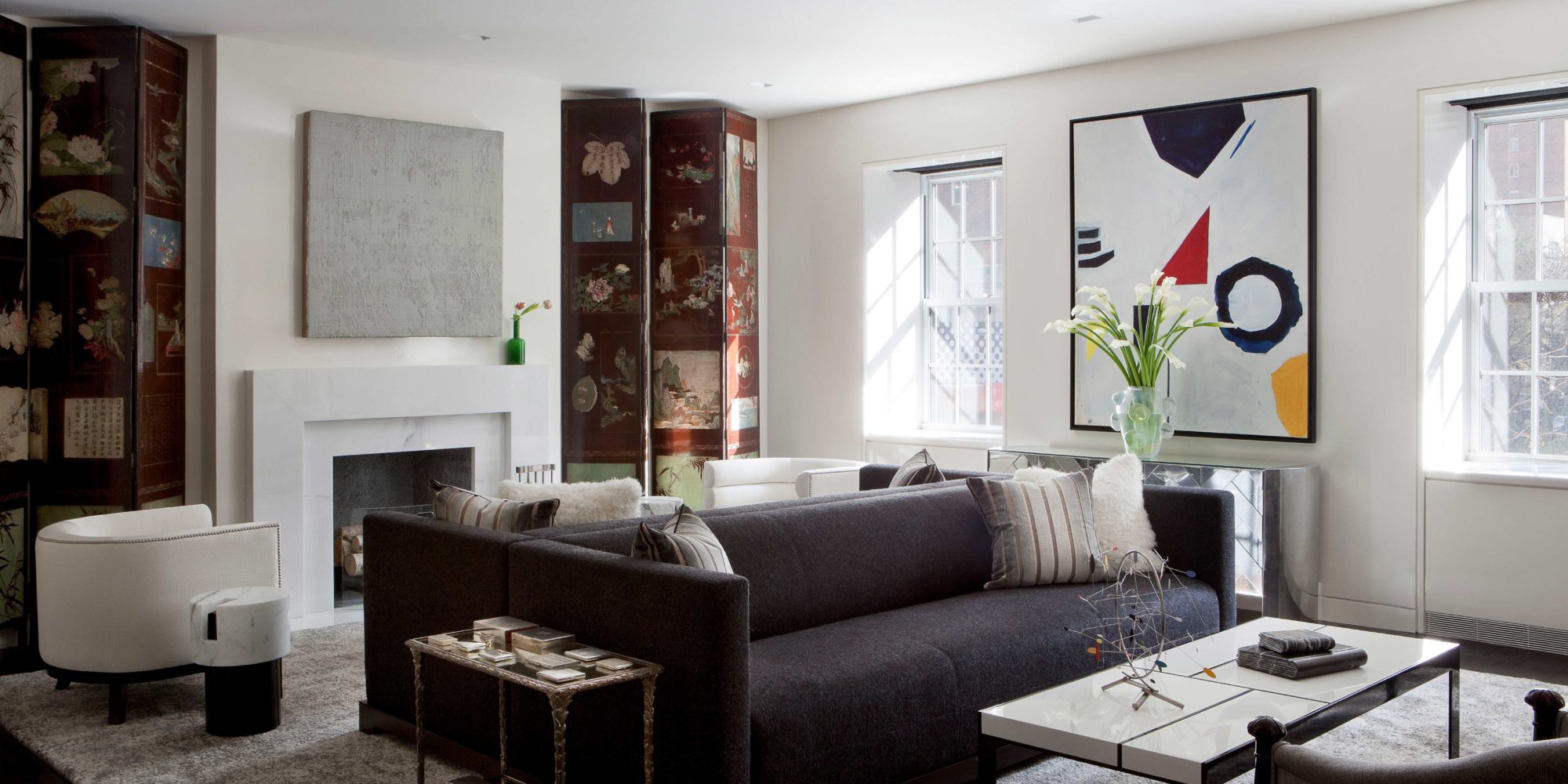 Beautifully designed living room designed by Soucie Horner incorporates custom banana silk rug by SHIIR, Zebedee Jones Painting, and Custom sofas using Jean de Merry upholstery.