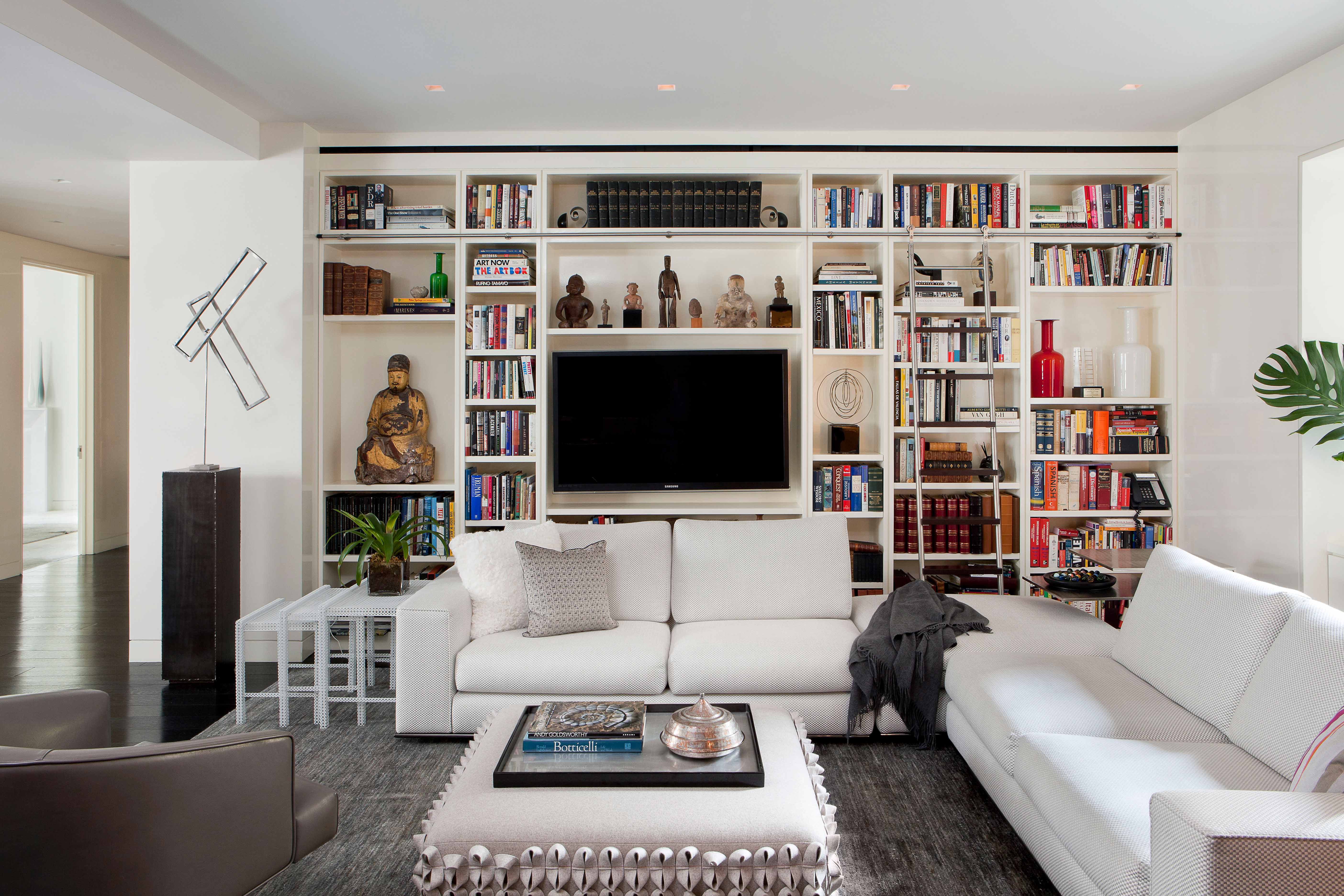 Beautiful family room designed by Soucie Horner incorporates Pakistan Wool Rug, Custom Square Ottoman from Anne Kyrro Quinn, and Accent Pillows from Couture for Homes.