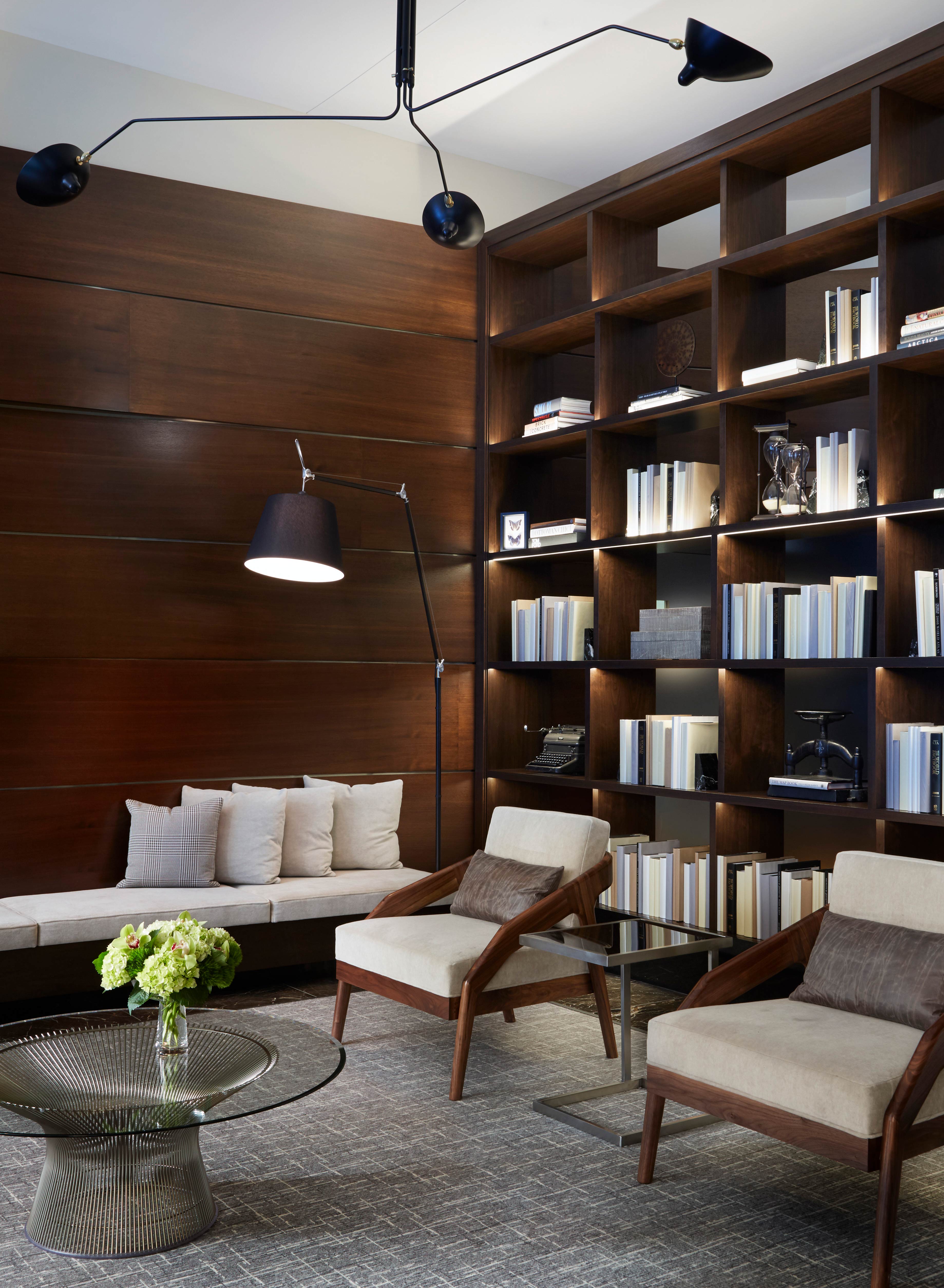 Burnham Pointe Lobby transformed by Commercial Interior Designer and Architects and Soucie Horner, incorporating Platner Coffee Table from Knoll Studio, Belle Meade Hospitality Lounge Chairs using Pindler and Pindler upholstery, and custom banquette.