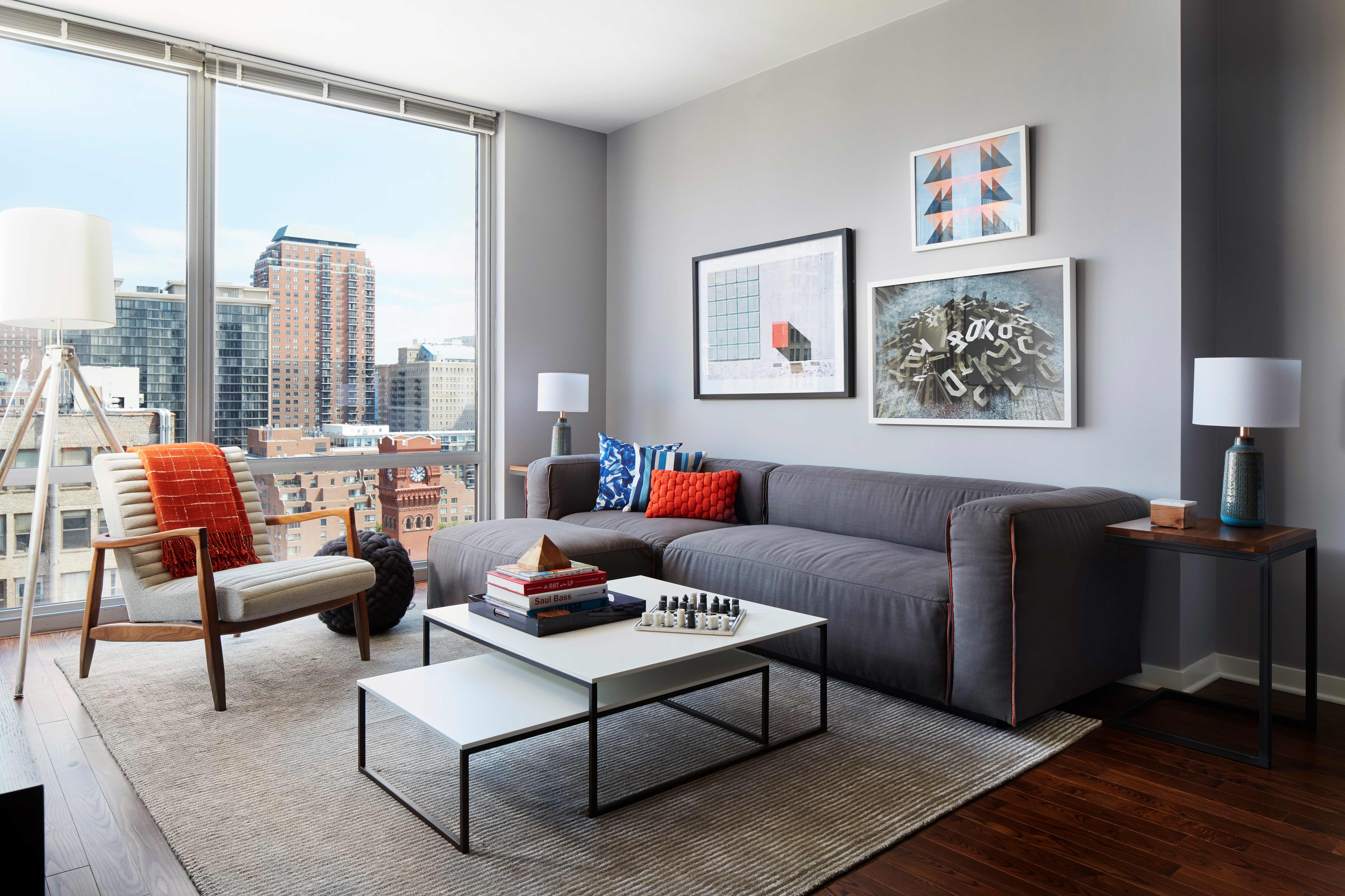 Burnham Pointe's Model Unit Transformation in Chicago - Soucie Horner, Ltd, incorporating Blu Dot Sectional, Room and Board Armchair, and Pair of Nesting Tables from Bo Concept.