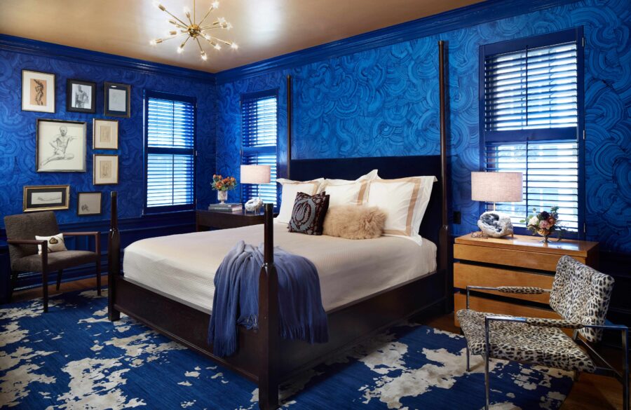 Beautiful and blue master bedroom incorporates SHIIR Rug, Custom Poster Bed, Bedding from Matouk, and Christiaan Pretorius Wallcovering.