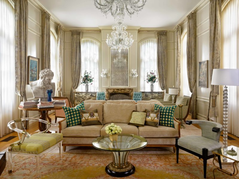 Beautifully Designed Living Room incorporates Italian Art Deco Sofa from William Switzer, Antique Cocktail Table from Epoca, One Ice Cube Floor Lamp from Porta Romana, and Lucite Throne from Charles Hollis Jones.