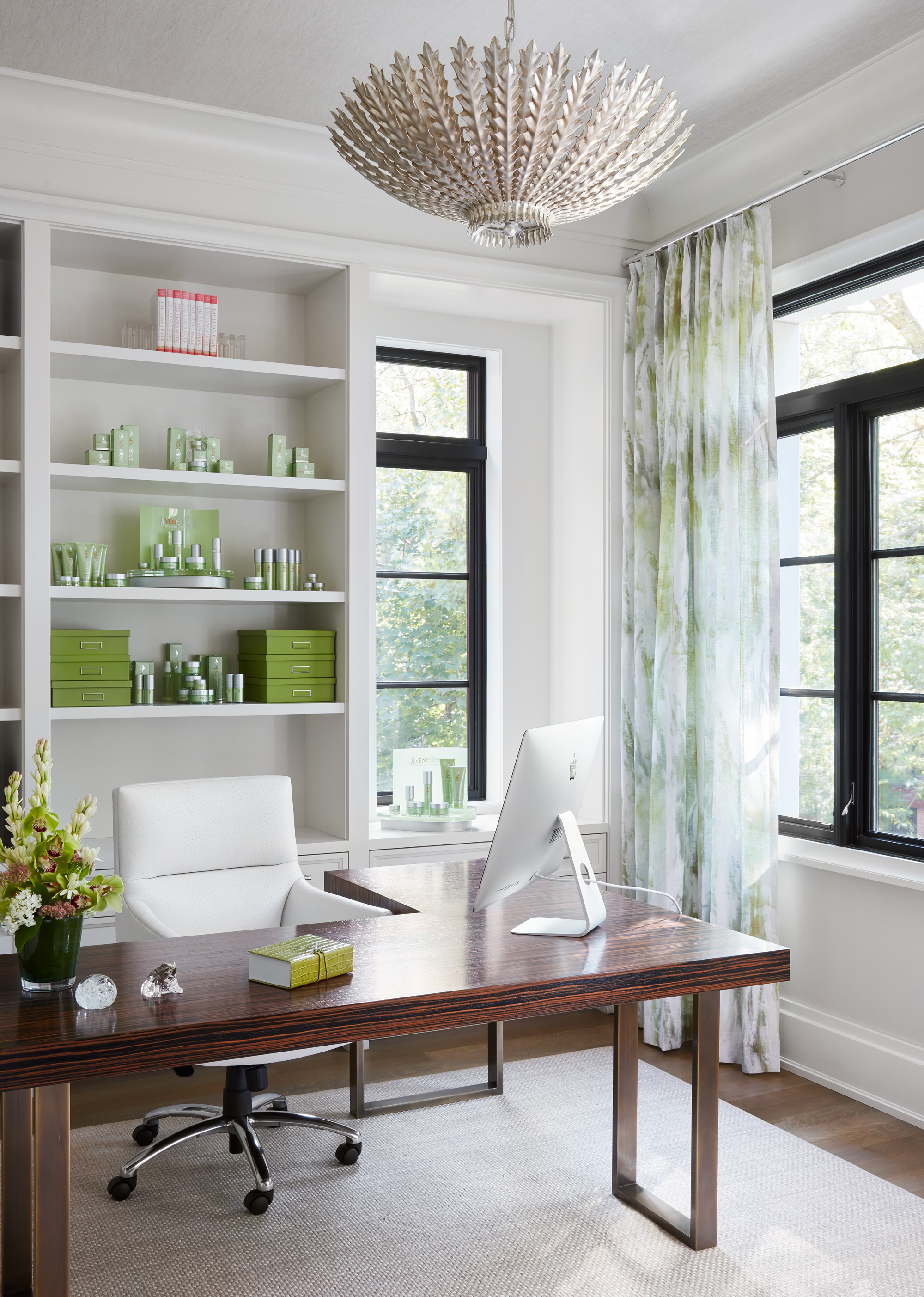 Bright and green home office incorporates Knoll Task Chair, LexMod Table, and client's companies green products.