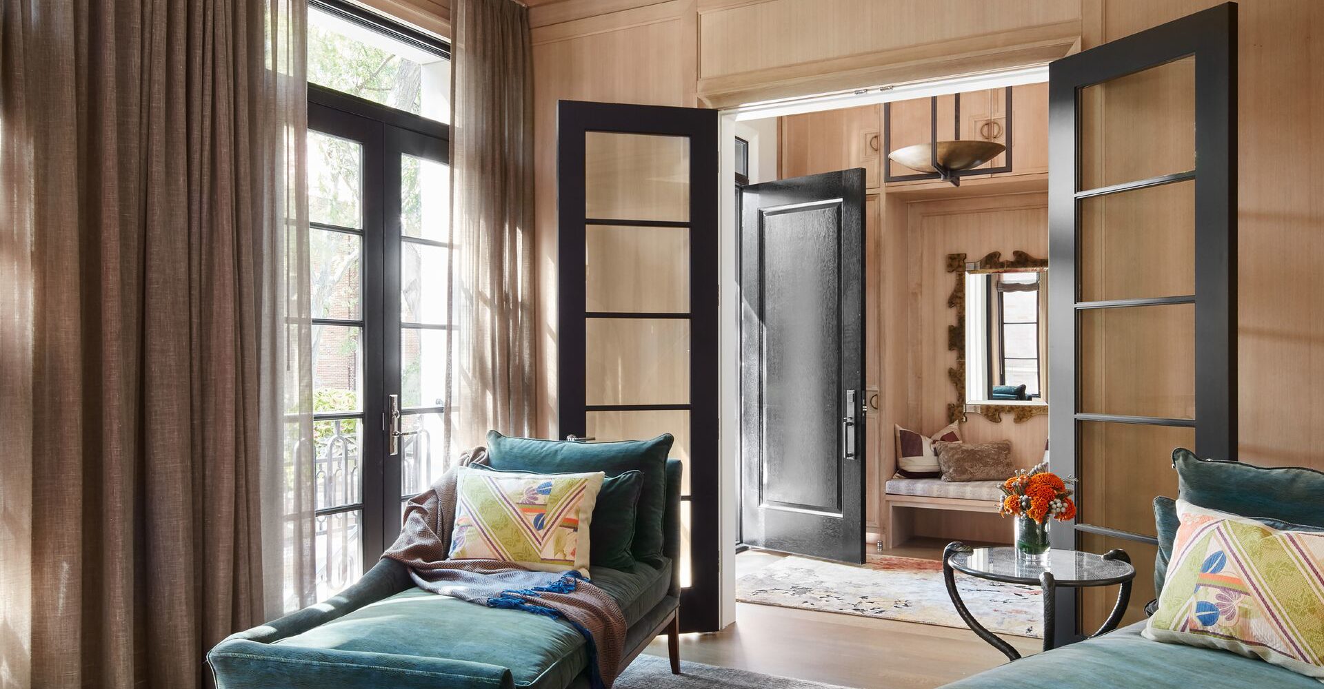 Bright and Contrasting Study incorporating Compendio Rug by SHIIR, Chaises by Lee Jofa, and Pagani Chandelier