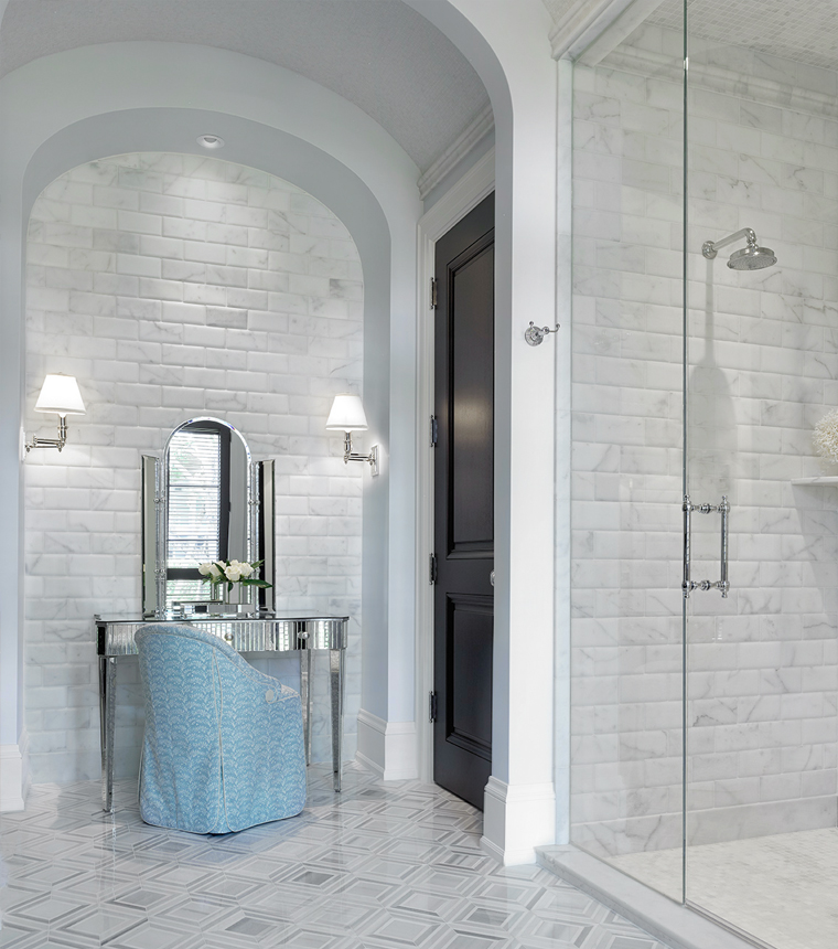 Bright and airy coastal modern Palm Beach master bath with marble brick and mirrored vanity