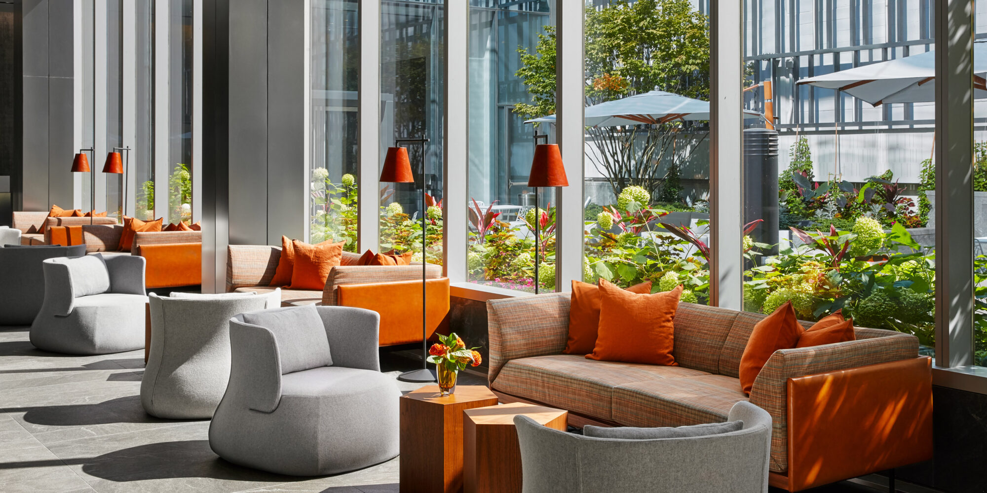 Indoor Work and Lounge Area including vibrant orange sofas and club swivel chairs
