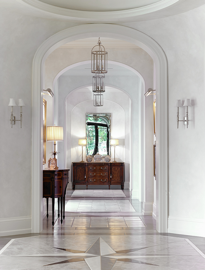 Bright and airy coastal modern Palm Beach living room with round lanterns by Hector Finch