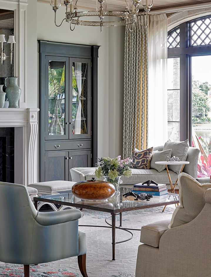 Bright and airy coastal modern Palm Beach sitting room with antique statement lighting by Charles Edwards, sofa by A.Rudin, and Lee Jofa Chaise Lounge