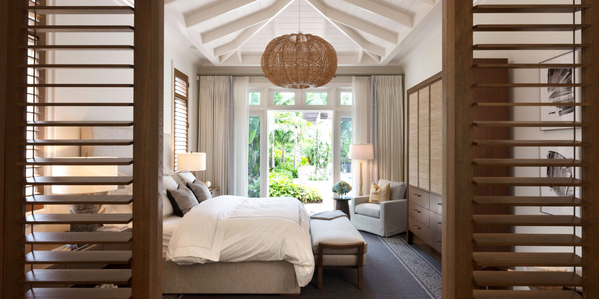 Bright and Airy Bedroom opens up to luscious greenery and beautiful Florida weather.
