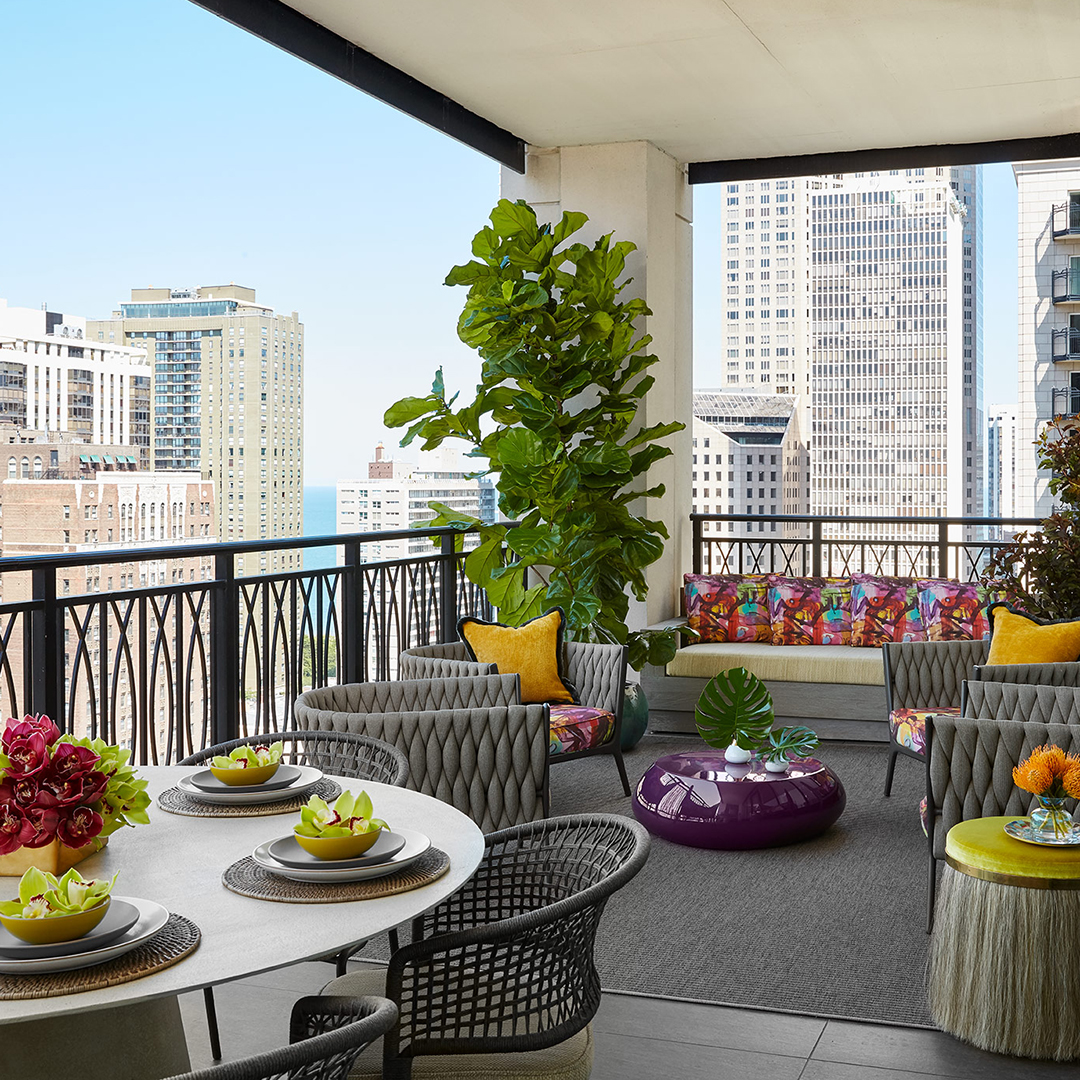 Bright Terrace Overlooking the Chicago City Skyline with Restoration Hardware Sofa and David Sutherland Table